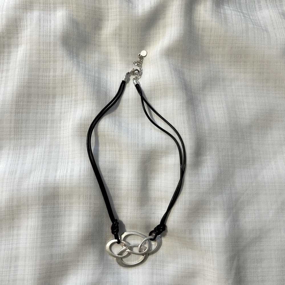 Cord necklace with silver pendent